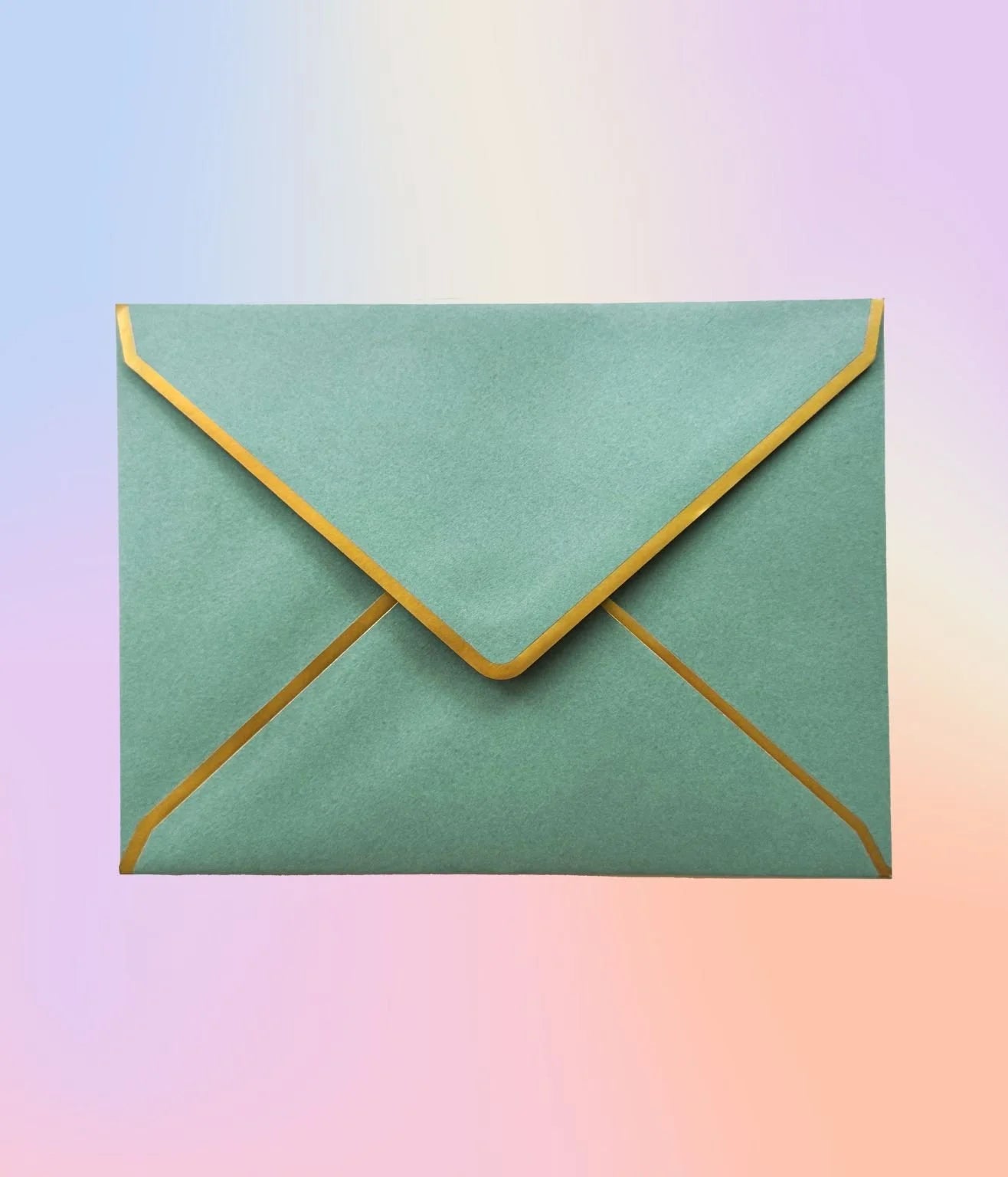 Sage green envelope with gold foil edging, photographed on a pastel background.