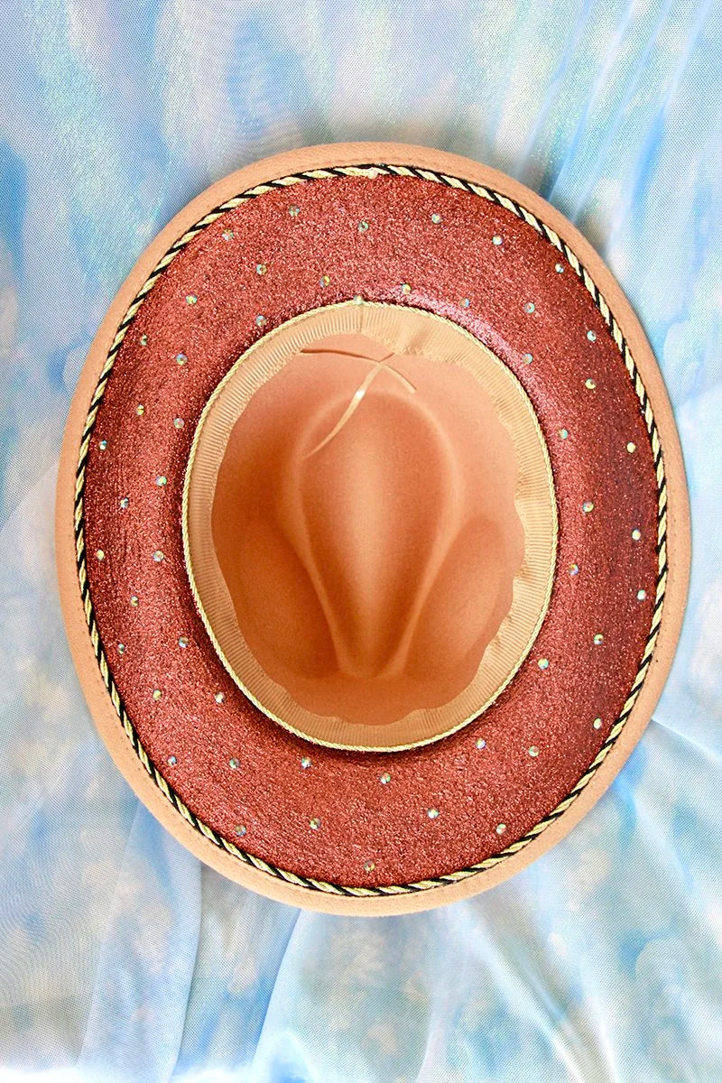 Top interior view of tan fedora with bronze glitter underbrim and rhinestone accents.