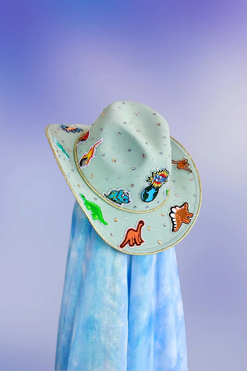 Front view of the Dino Rodeo cowboy hat in mint with dinosaur motifs, rhinestones, and gold trim.