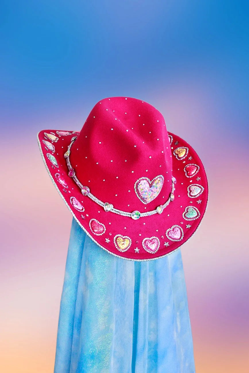 Front view of the Love Struck cowboy hat in pink and magenta with heart rhinestones, silver trim, and glitter detailing.
