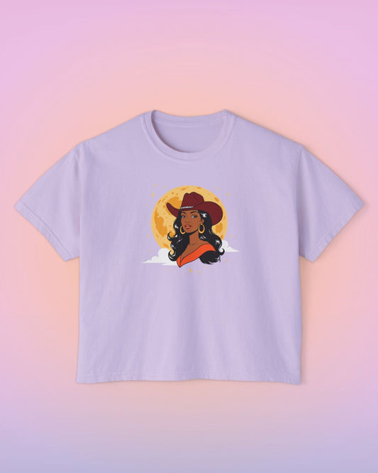 Lavender cropped graphic tee featuring the Full Moon Goddess illustration, a western-inspired cowgirl under a golden moon.