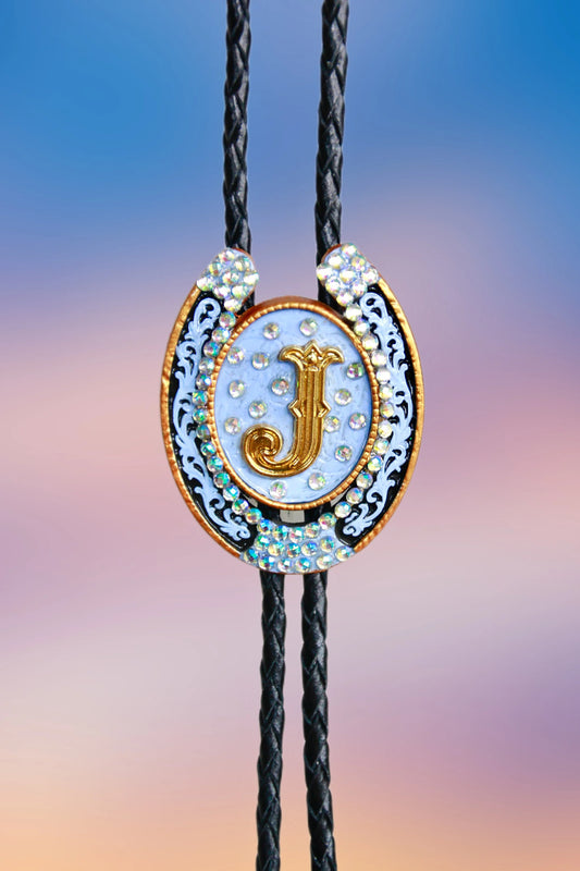 Front view of the hand-painted horseshoe pendant with gold “J,” scrollwork accents, and iridescent rhinestones.