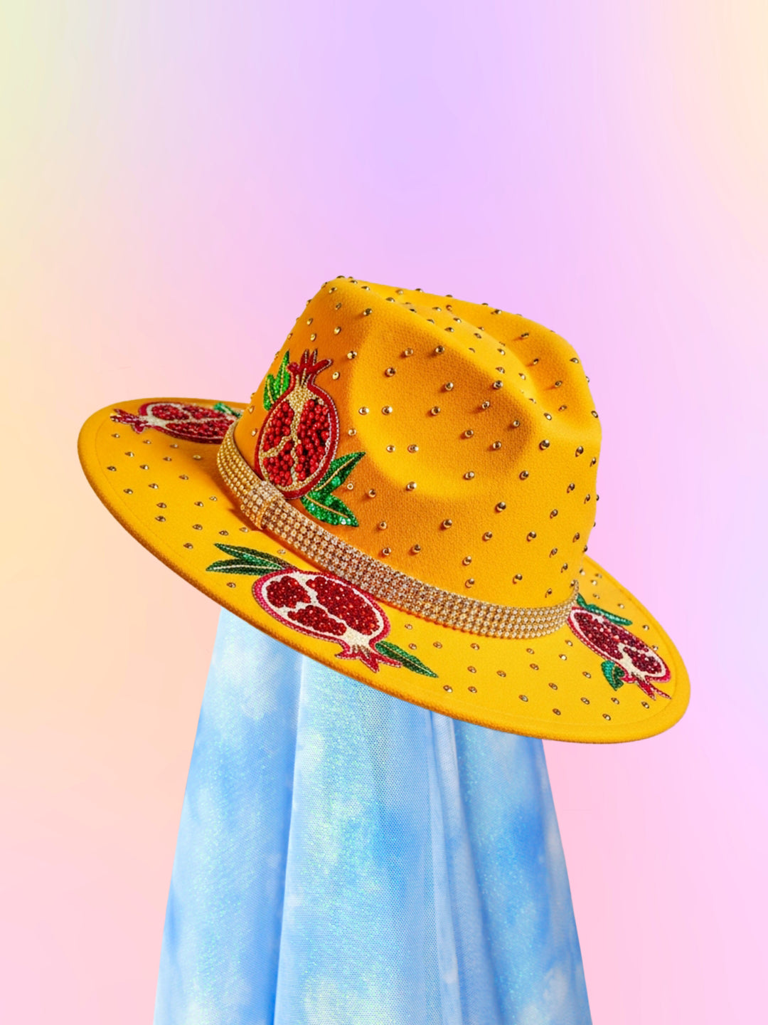 Yellow fedora with beaded pomegranate appliqués and a rhinestone band, shown at a front angled view.
