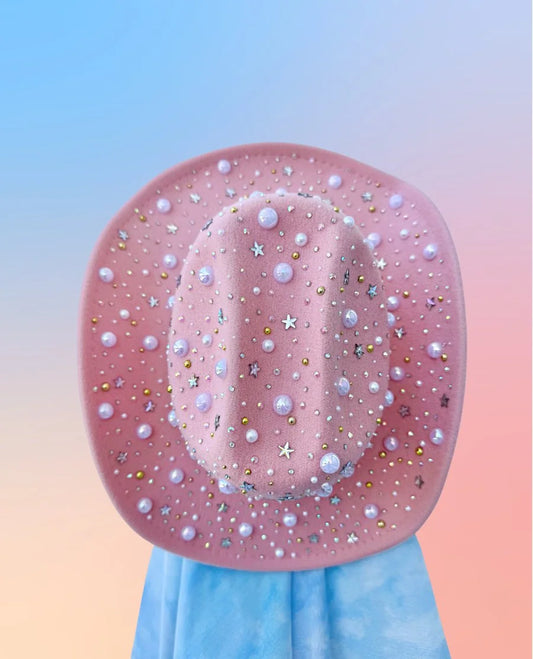 Pink cowboy hat with pearls and stars, full brim view.