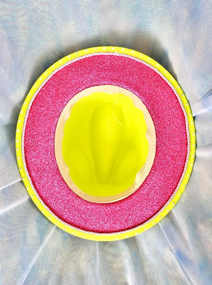 Top interior view of lime green fedora with pink glitter underside and polka dot trim.