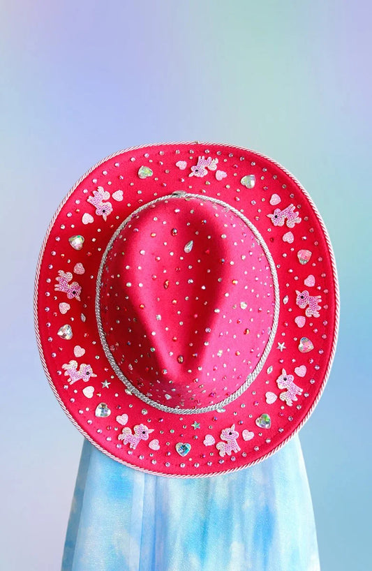 Top view of pink unicorn dream cowboy hat with rhinestones and unicorn appliqués.