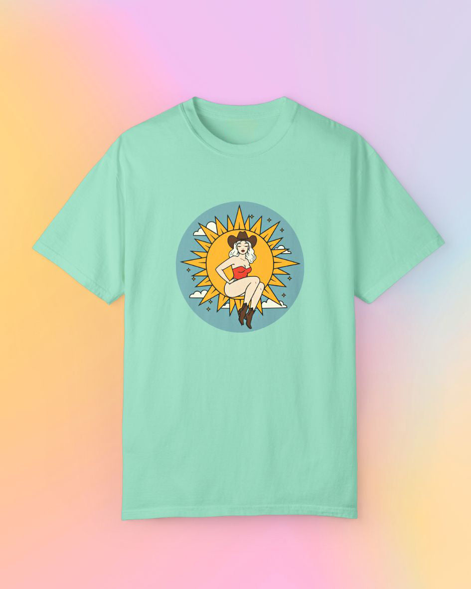 Full Moon Goddess classic t-shirt in mint green, folded flat with sun goddess western illustration on front.