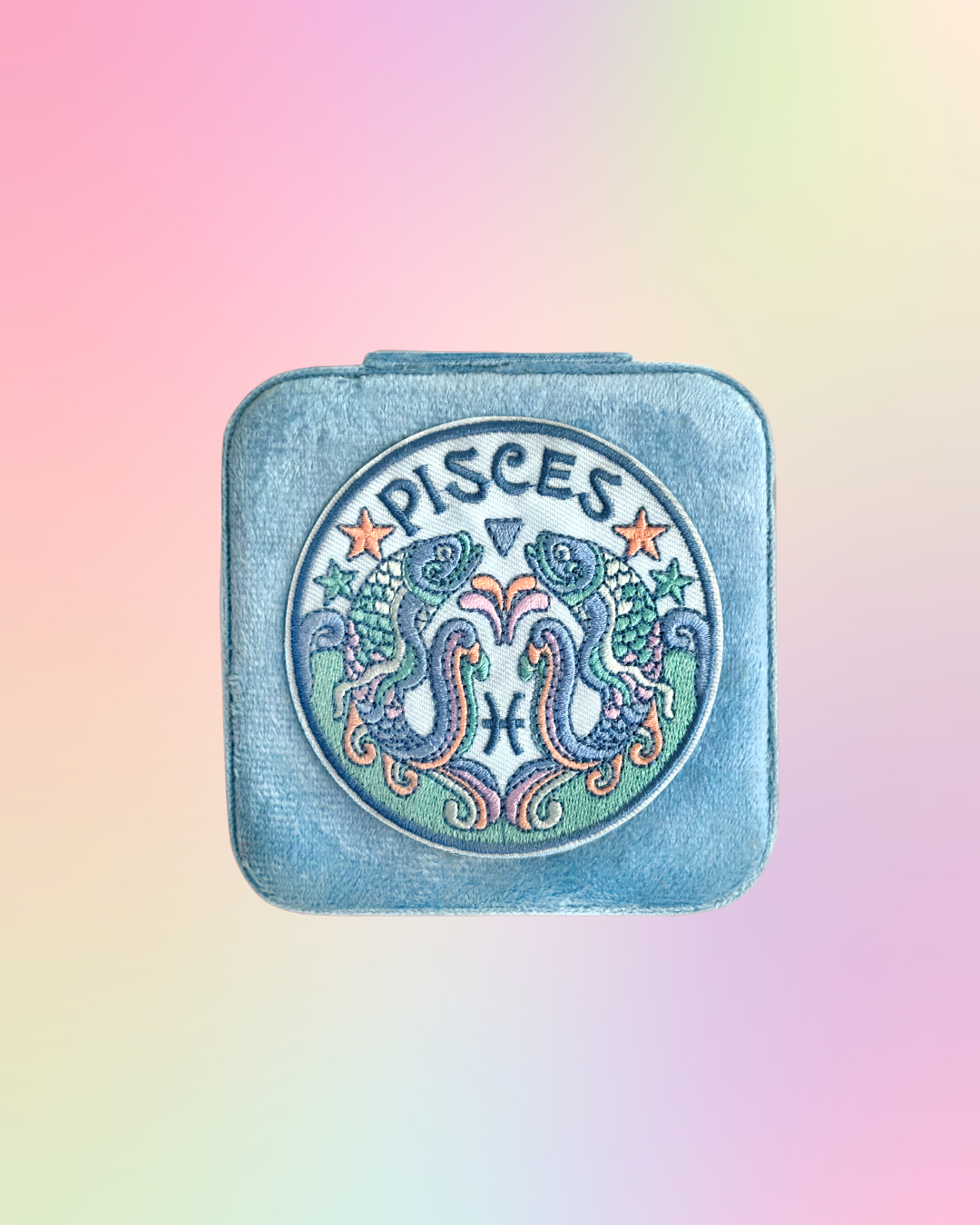 Pisces zodiac sign design on a square, light blue, jewelry case on a gradient background.