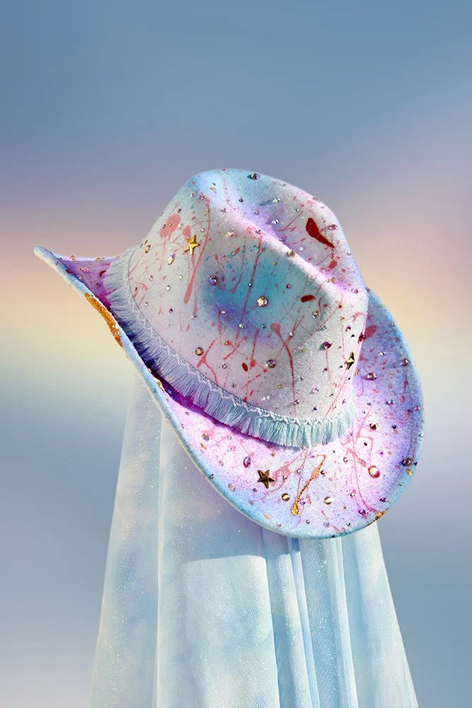 Artist cowboy hat with multicolored paint splatter design and rhinestone embellishments.