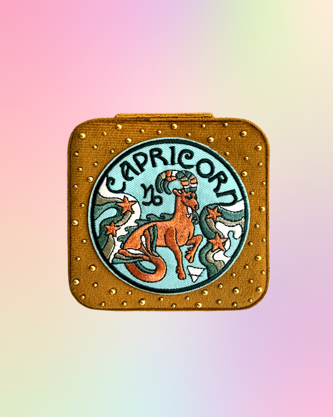 Capricorn velvet zodiac jewelry box with embroidered zodiac patch and gold rhinestone details.