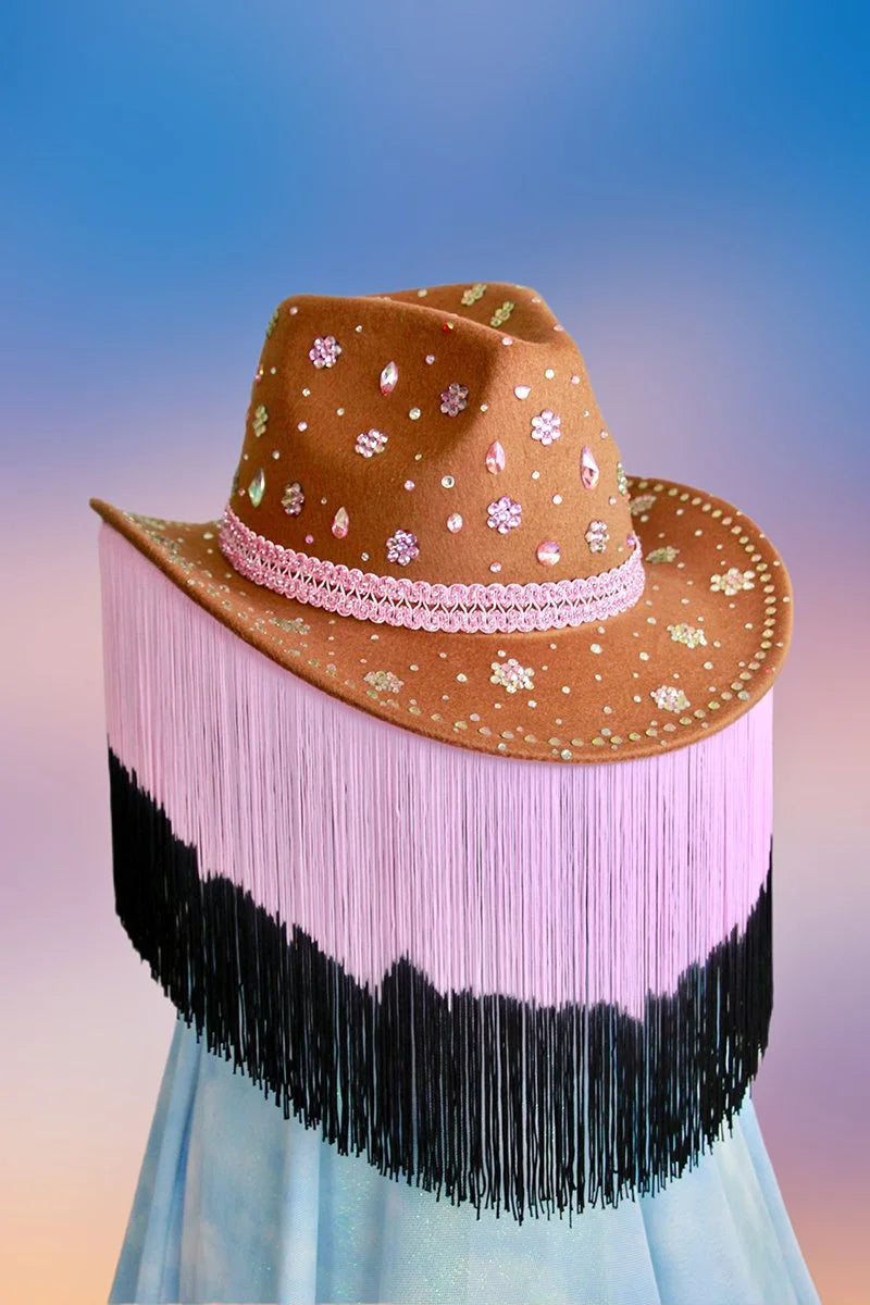 Front view of camel cowboy hat decorated with floral motifs and pink rhinestones.
