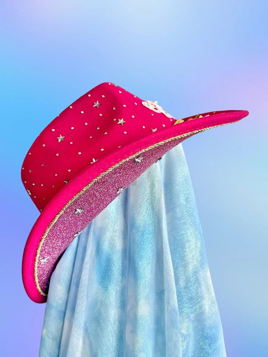 Pink cowgirl hat with glitter underside and star details.