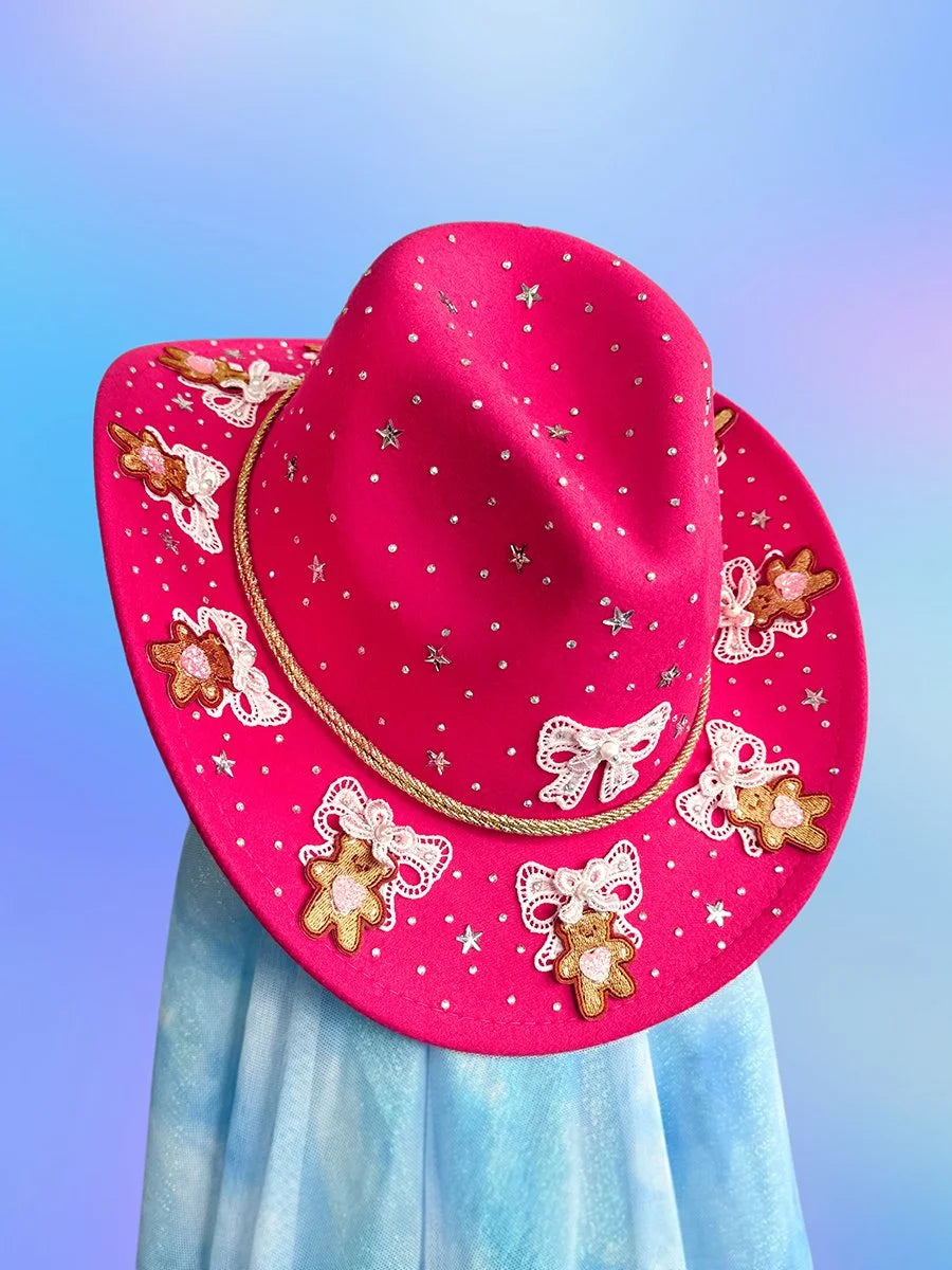 Coquette-inspired embellished cowboy hat with bows and hearts.