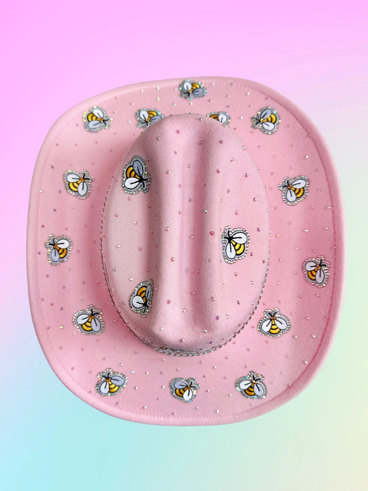 Top view of pink bee-themed cowboy hat covered in rhinestones.