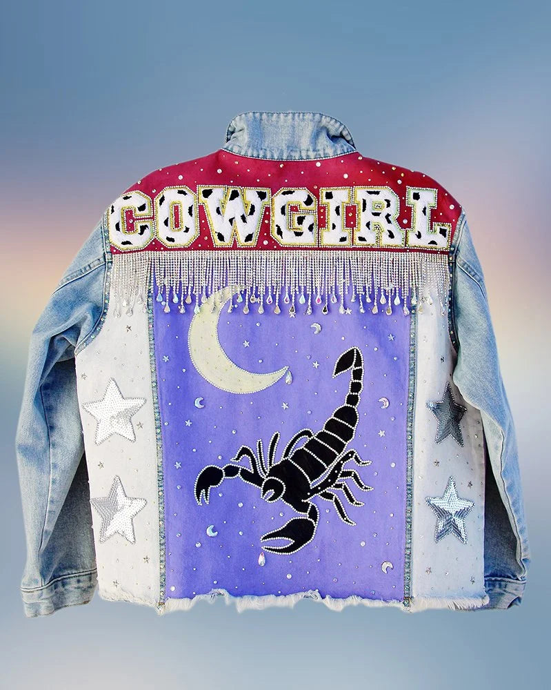 Back view of hand-painted Desert Nights denim jacket in size XL with star embellishments.