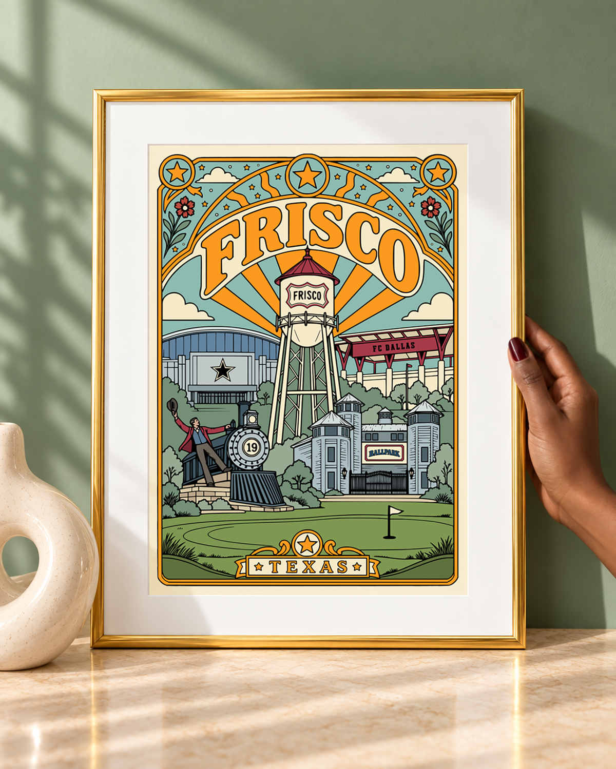 Frisco Texas wall art displayed with a white mat in a modern frame against a sage green backdrop.