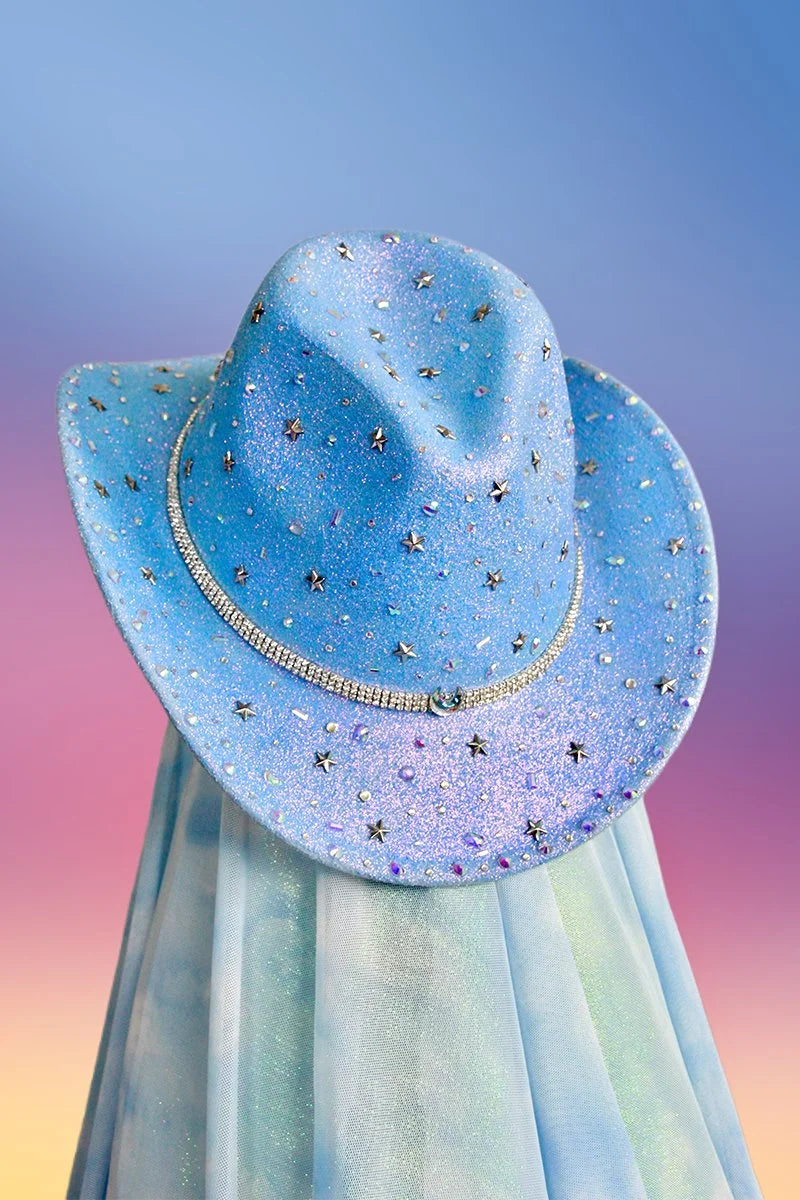 Front view of the Cinderella’s Dress cowboy hat in iridescent blue with moon and star motifs, clear gems, and silver trim.