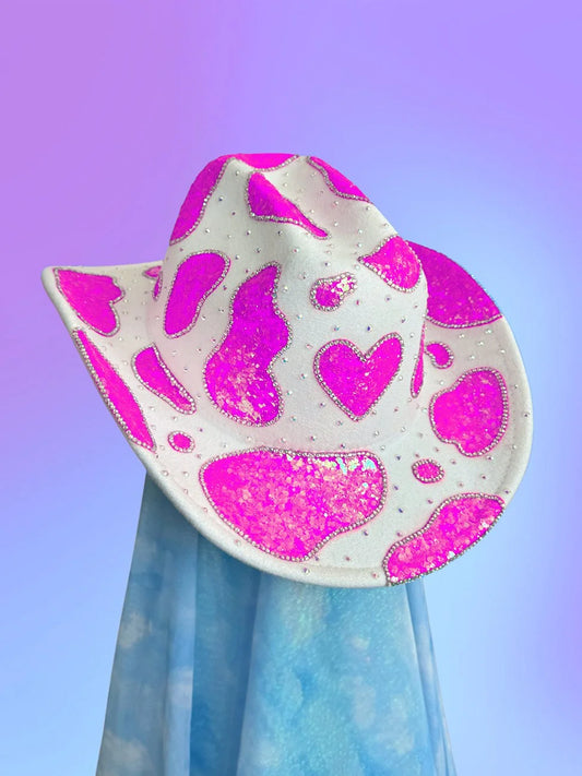 Front view of the Fuchsia Crush cowboy hat in white with iridescent fuchsia glitter and rhinestone heart motif.