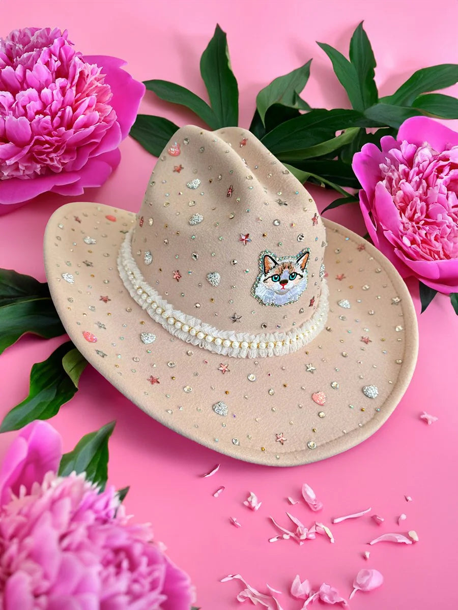 Front view of the Meowdy Miss cowboy hat in light tan with cat motif and mixed rhinestone embellishments.