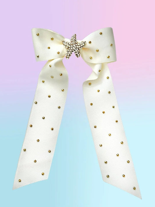 Front view of the large Ocean Darling hair bow with creamy white ribbed ribbon, gold sea star brooch, and rhinestone accents.