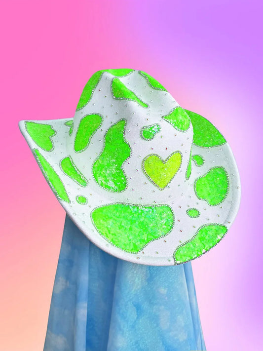 Front view of the Shamrock Sheriff cowboy hat with white base, neon green glitter, and rhinestone heart motif.