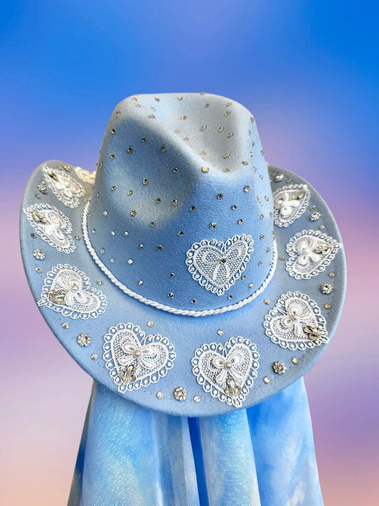 Front view of the Something Blue cowboy hat in baby blue with lace heart motifs, silver rhinestones, and glitter detailing.