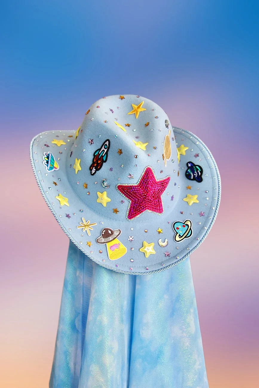 Front view of the Space Cowboy hat in baby blue with space-themed rhinestones, blue glitter, and yellow star accents.