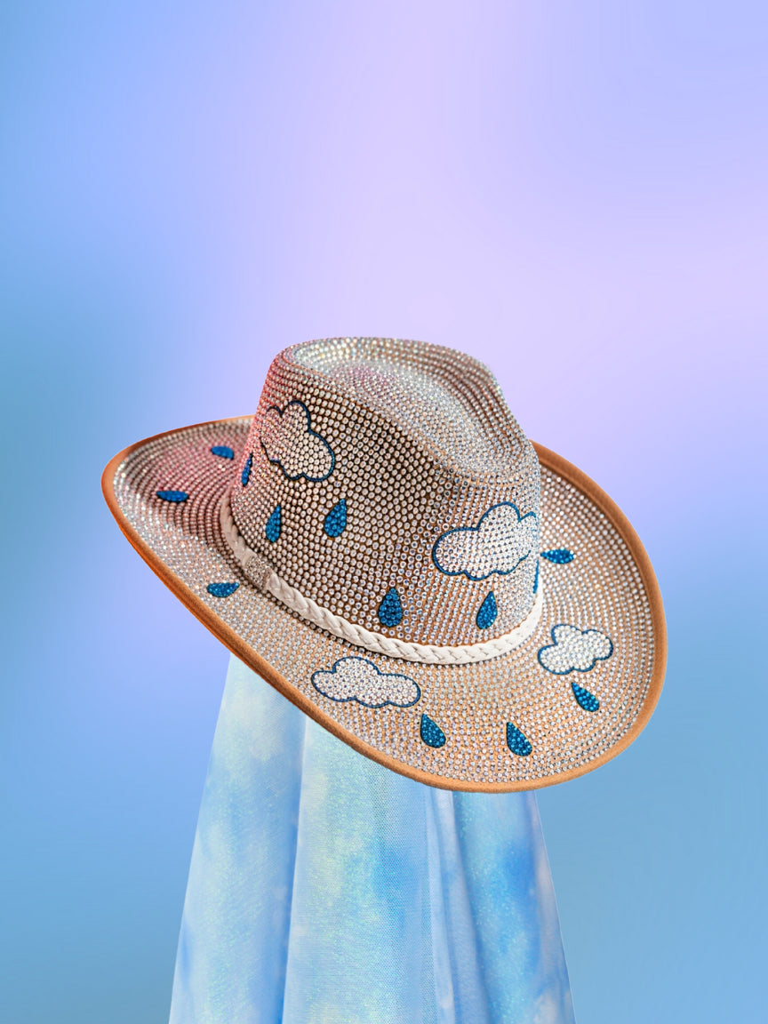 Front view of the Spring Showers cowboy hat with tan base and blue, silver, and iridescent rhinestone rain cloud motif by Neon Dancing Cowboy.