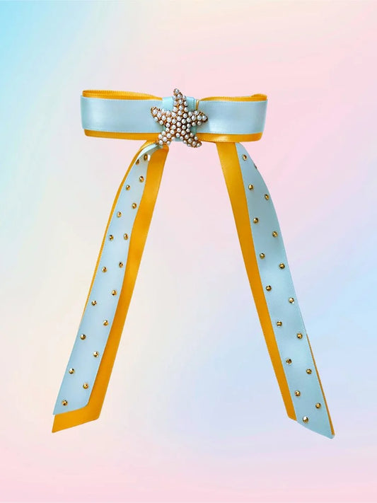 Front view of the Sun & Sea hair bow with blue and yellow satin layers, gold sea star centerpiece, pearls, and rhinestones.