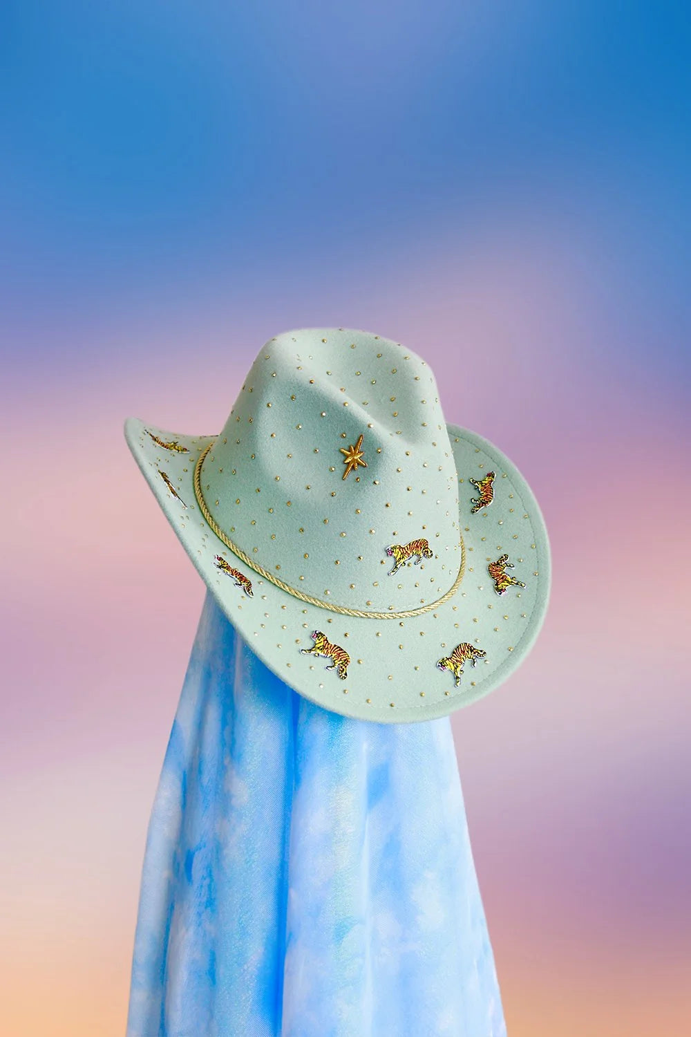Front view of the Tiger Tales cowboy hat in mint with tiger motifs, gold rhinestones, and glitter detailing.