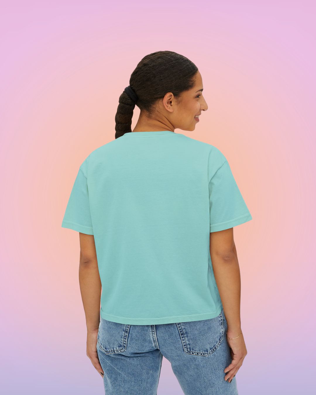 Back view of cropped oversized women’s tee in chalky mint, relaxed fit with a clean, minimalist silhouette.
