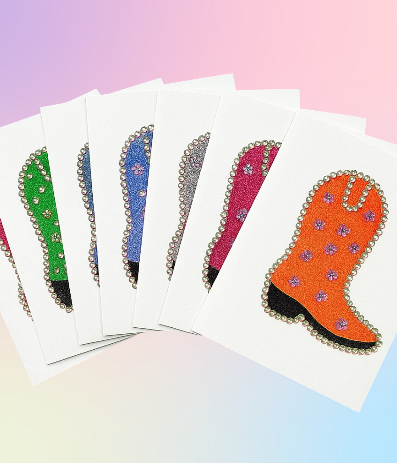 Set of glitter Western boot greeting cards in multiple colors, fanned out on a gradient background.