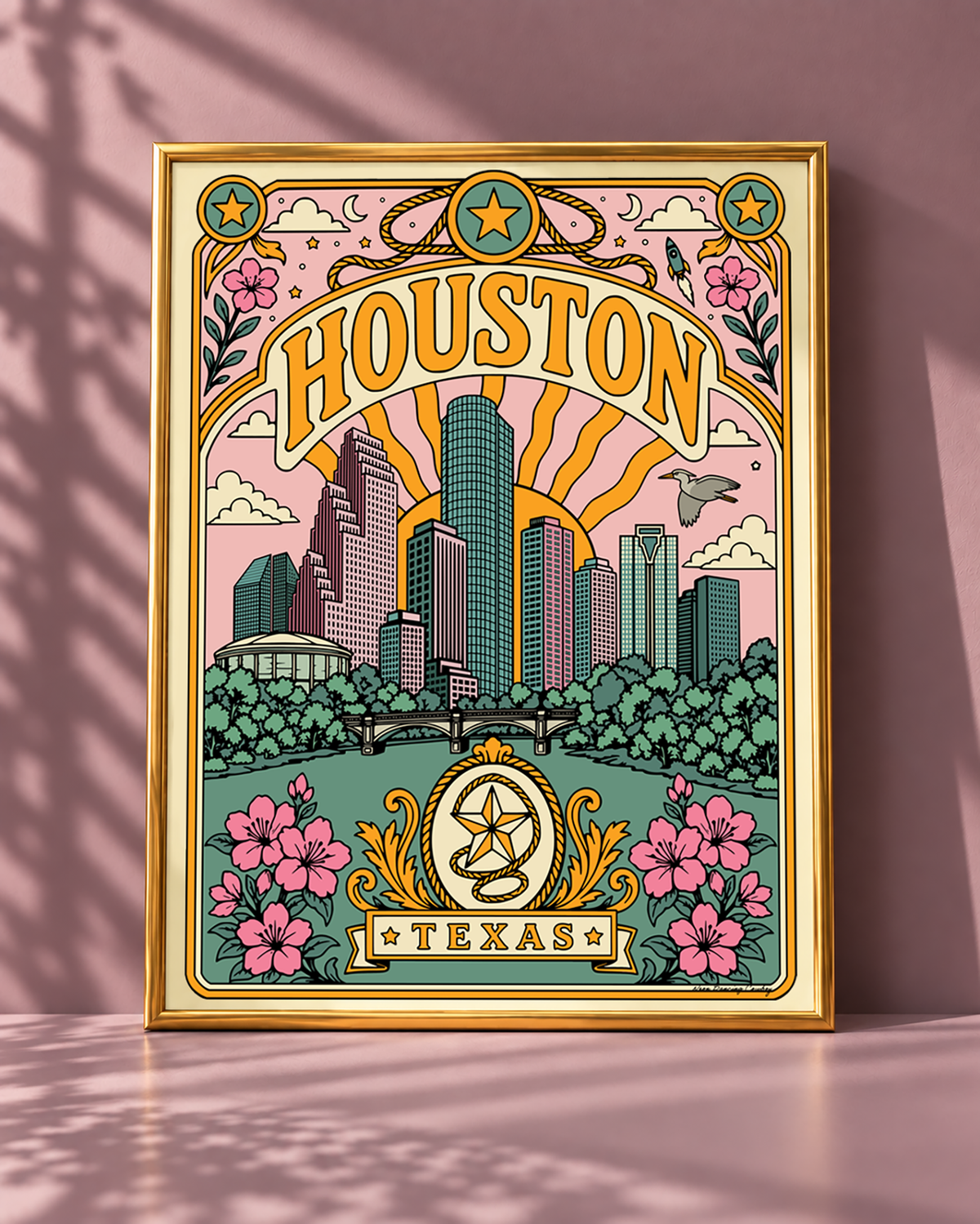 Houston Texas wall art displayed in a slim modern gold frame against a smoky mauve background.