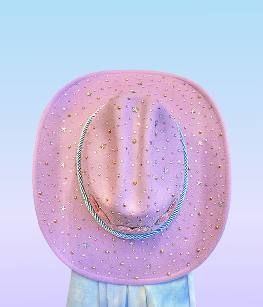 Top view of lavender cowboy hat featuring scattered stars and rhinestones.