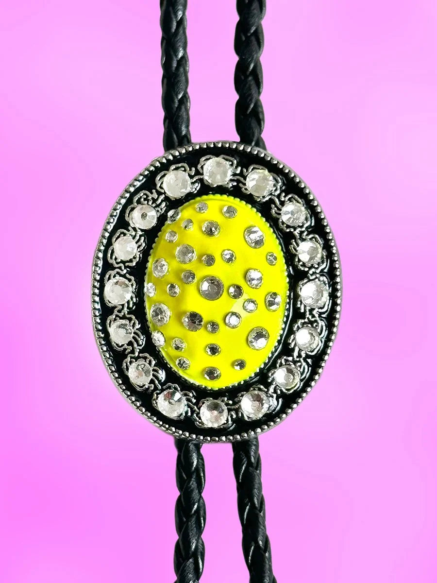 Close-up of the Lemon Glow Bolo Tie pendant with vibrant yellow paint and clear rhinestones.