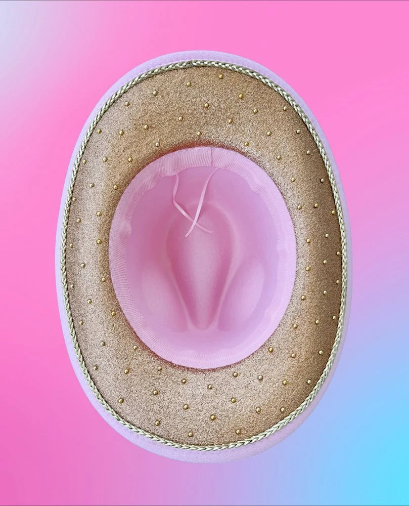 Underside of Lucky Lotus cowboy hat featuring champagne glitter and gold detailing.