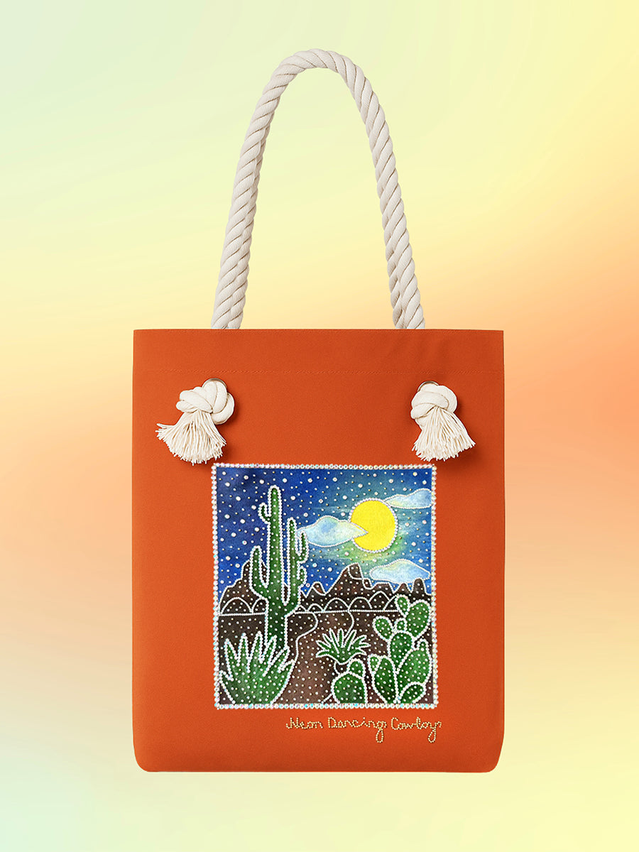 Front of the Luna Mesa Tote with hand-painted desert nightscape, cacti, and moon artwork.
