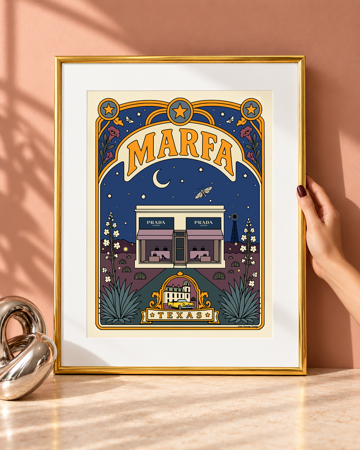 Marfa Texas art print with a white mat displayed in a slim modern gold frame.