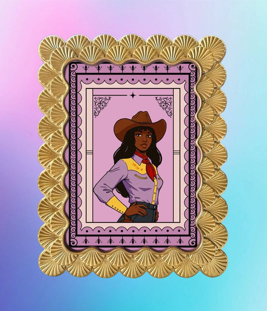 5x7 Maya Wilson cowgirl art print displayed in a scalloped gold frame on a pastel gradient background.