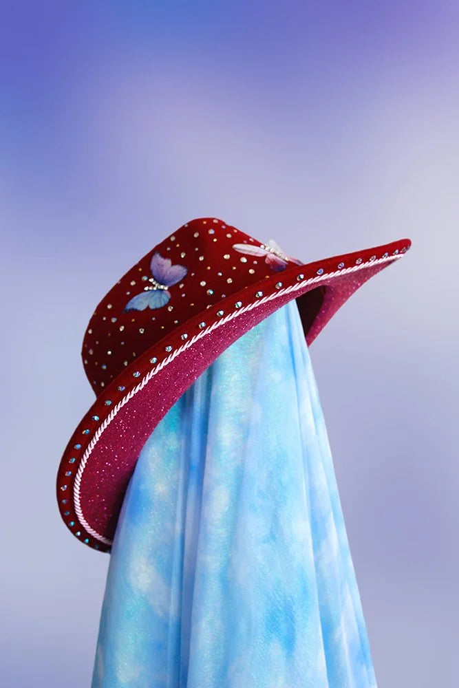 Side profile of the maroon Midnight Garden cowboy hat with decorative trims and rhinestones.