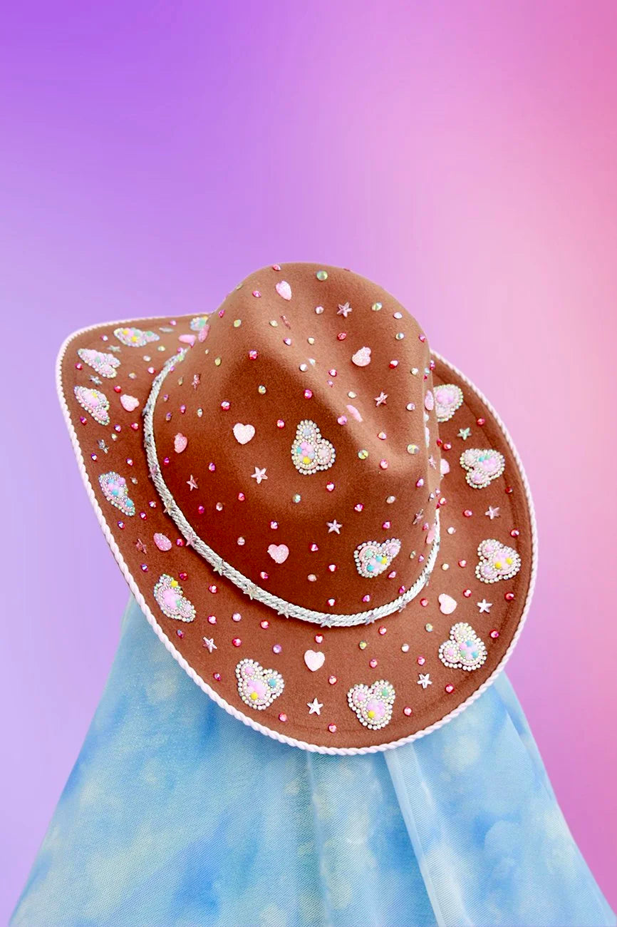 Light brown cowboy hat with rhinestones, stars, and Mickey Mouse silhouettes on the brim.