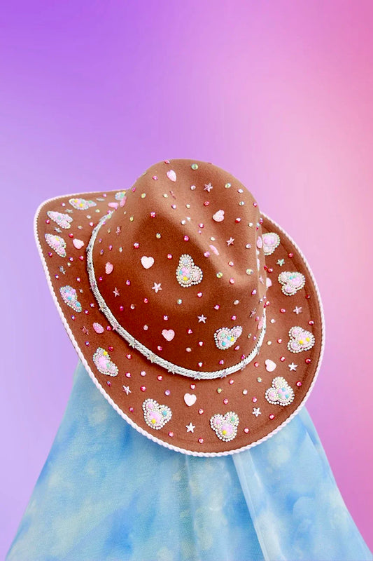 Light brown cowboy hat with rhinestones, stars, and Mickey Mouse silhouettes on the brim.