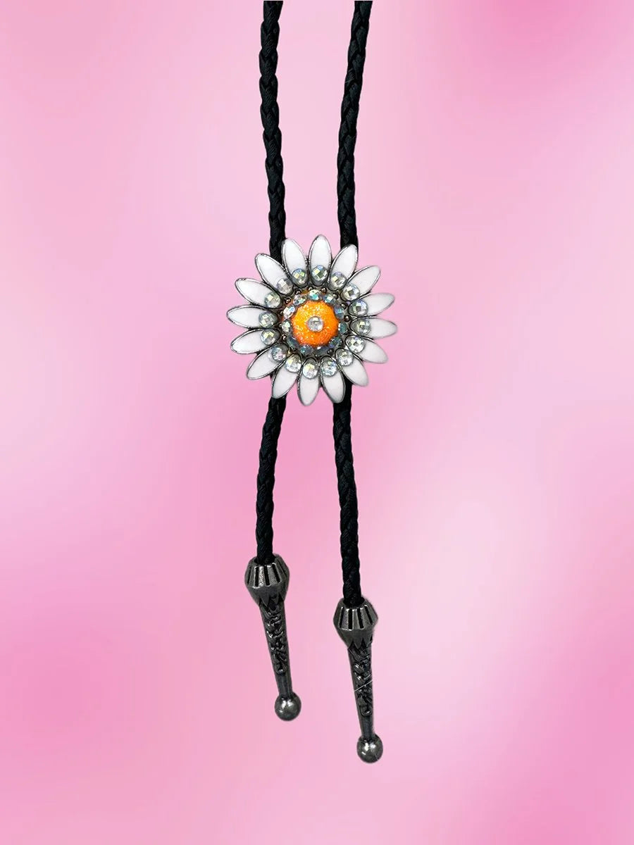 Full-length view of the Neon Daisy Bolo Tie showing the daisy pendant and silver metal tips on a braided black rope.