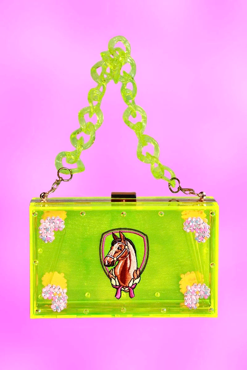 Neon-green acrylic clutch shown with short resin chain strap and pony emblem artwork.
