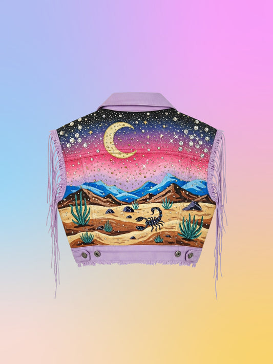 Hand-painted lavender denim vest with scorpion desert night scene and rhinestones.
front view of lavender denim vest with rhinestones and painted details.
