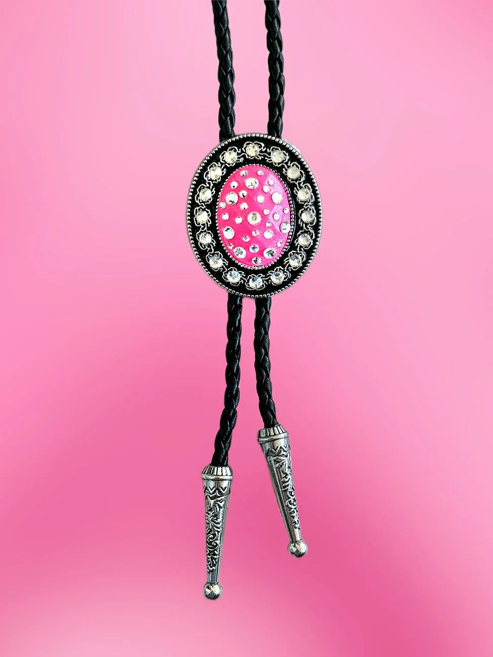 Front view of the Passionate Pink Bolo Tie with Barbie pink pendant and clear rhinestones on braided black rope.