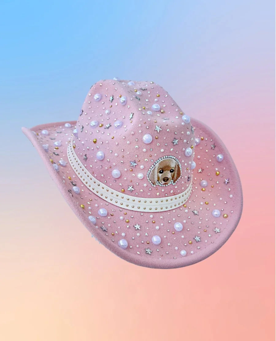 Pink puppies and pearls cowboy hat with star embellishments, side view.
