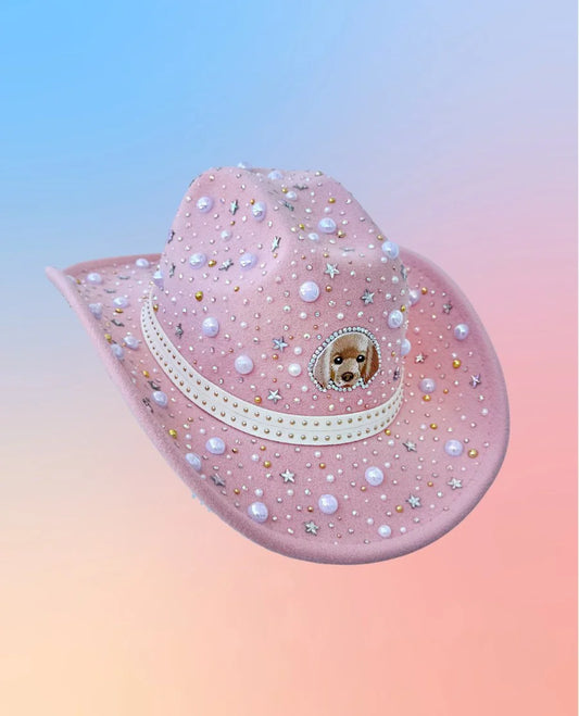 Pink puppies and pearls cowboy hat with star embellishments, side view.