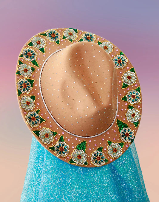 Top view of camel fedora with silver-blue glitter underbrim and beaded floral trim.