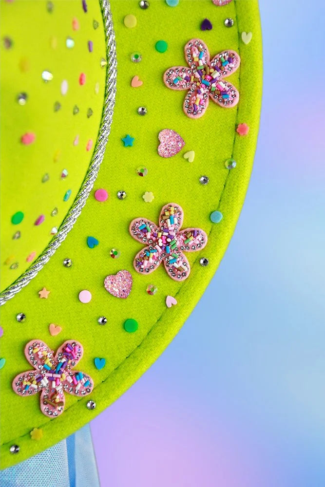 Detail shot of multicolor confetti dots and rhinestone florals on neon green fedora.